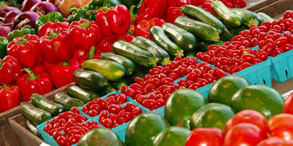 A public agriculture event with fresh produce displays